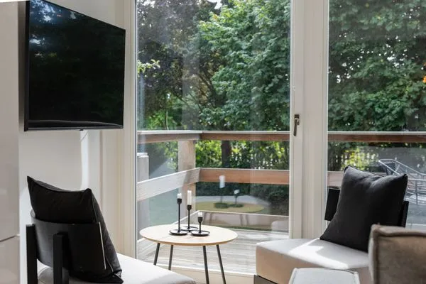 Wohnzimmer Haffperle Küstenglanz - zentral in Haffkrug, nur wenige Schritte zum Strand