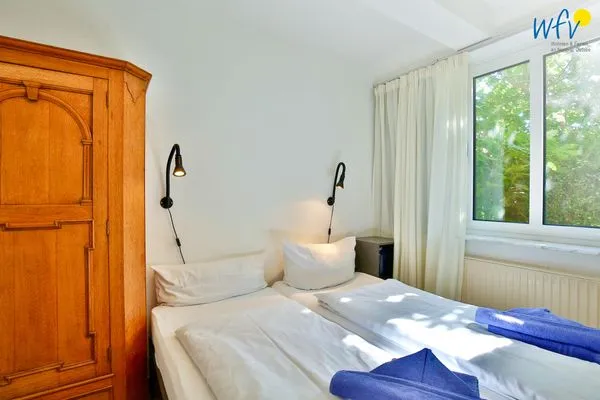 Schlafzimmer Haus Dünenblick Ferienwohnung 1