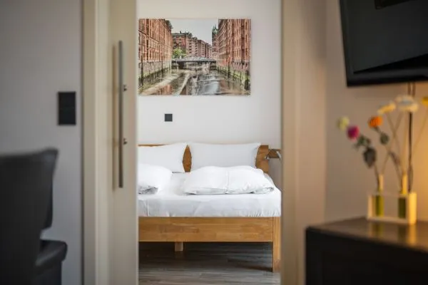 Ferienwohnung Altstadtapartment Carli Waren (Müritz) - gemütliches Schlafzimmer mit Doppelbett  Altstadtapartment Carli