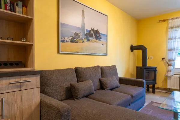 Wohnzimmer mit Kaminofen Am Deich Am Deich Haus 32
