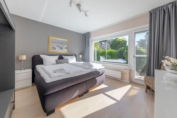 Schlafzimmer  6 East – großzügiges Ferienhaus mit Garten