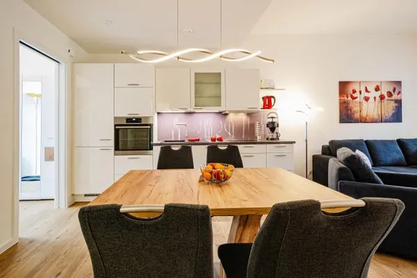 Wohnzimmer: Schlafsofa, TV (Netflix mit eigenen Zugangsdaten möglich),Zugang zur Terrasse  FeWo Ostseebrise in PRORA - 5.03