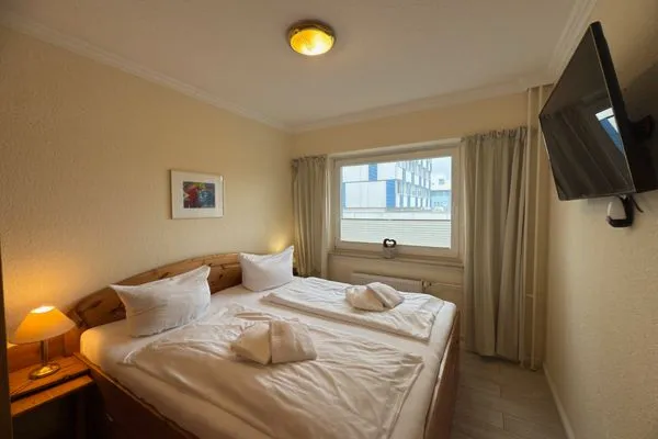 Schlafzimmer Ferienwohnung im Haus Nordland App 24