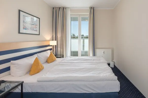 Apartment am Kurstrand Zingst - Schlafzimmer mit Doppelbett  Apartment am Kurstrand