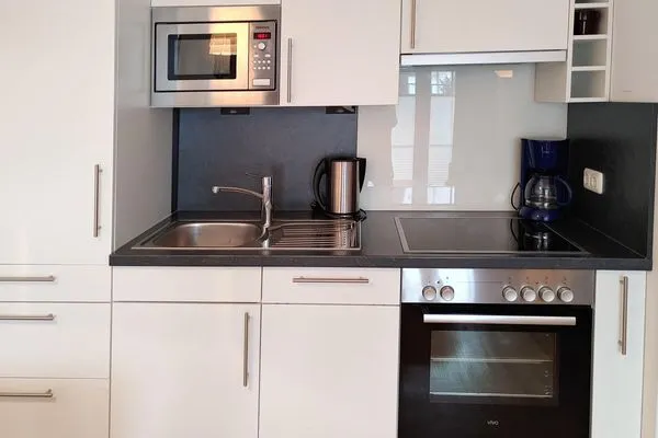 offene Küche in der Ferienwohnung Auszeit am Meer in Wittdün auf Amrum Haus *Südspitze 17* Ferienwohnung *Auszeit am Meer*