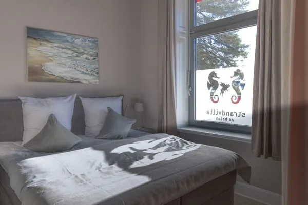 Schlafzimmer Strandvilla Hafenloge - stilvoll wohnen direkt am Niendorfer Hafen