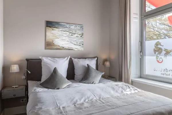 Schlafzimmer Strandvilla Hafenloge - stilvoll wohnen direkt am Niendorfer Hafen