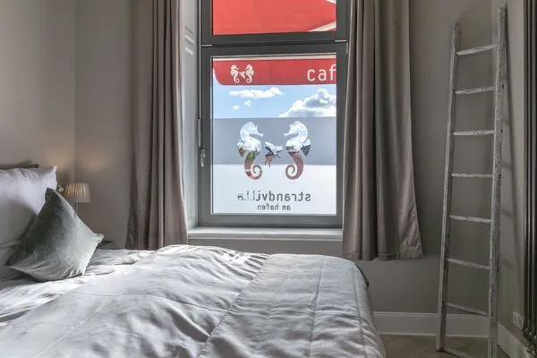 Schlafzimmer Strandvilla Hafenloge - stilvoll wohnen direkt am Niendorfer Hafen