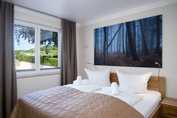 Schlafzimmer  Villa Nause, Ferienwohnung Buchenfreund mit Spa und Freizeit