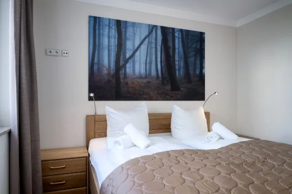 Schlafzimmer  Villa Nause, Ferienwohnung Buchenfreund mit Spa und Freizeit