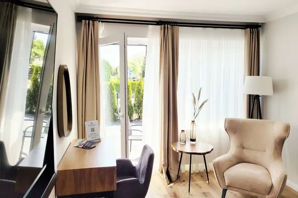 Eigener Zugang auf die Terrasse  Hochwertige Ferienwohnung in ruhiger Lage mit eigener Terrasse, nur 7 Gehminuten zum Strand entfernt