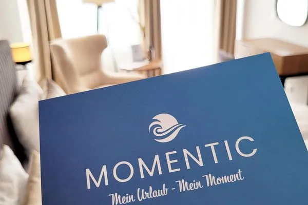 Unser Momentic-Team ist immer für Sie da!  Hochwertige Ferienwohnung in ruhiger Lage mit eigener Terrasse, nur 7 Gehminuten zum Strand entfernt