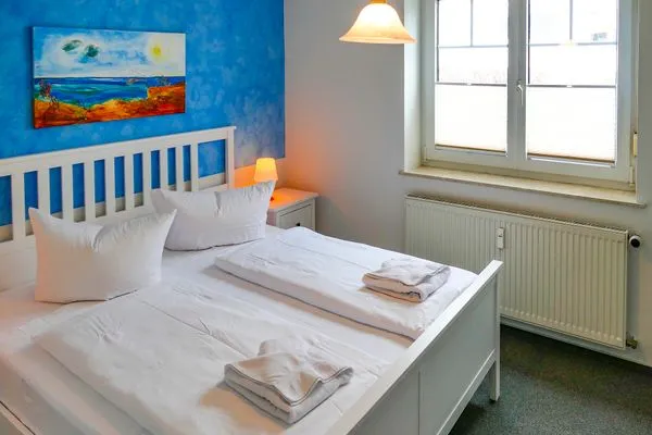 Schlafzimmer  Ferienappartement Fraenzi - mit herrlichem Meerblick