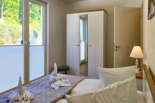 Schlafzimmer  Aparthotel am Nationalpark, Wohnung Wald & Meer - modern und rollstuhlgeeignet
