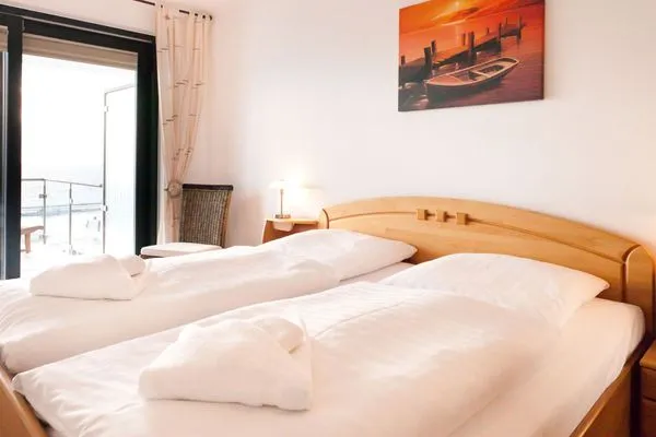 Schlafzimmer  Villa Friede-Marie, App. Meeresidyll - mit herrlichem Ostseeblick und Balkon