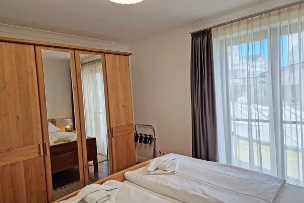 Schlafzimmer  Villa Friede Marie, App. Finja - Hafen-Ostsee-Blick und Balkon