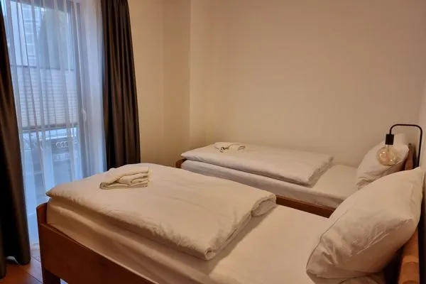 Schlafzimmer  Villa Friede Marie, App. Finja - Hafen-Ostsee-Blick und Balkon