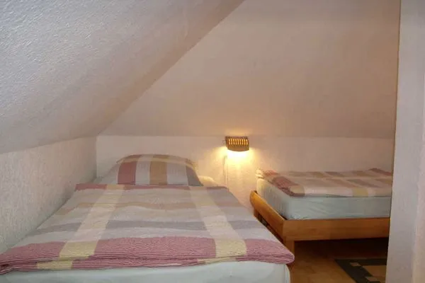 Schlafzimmer  Villa Exxs, Whg. 7 "Harmonie"