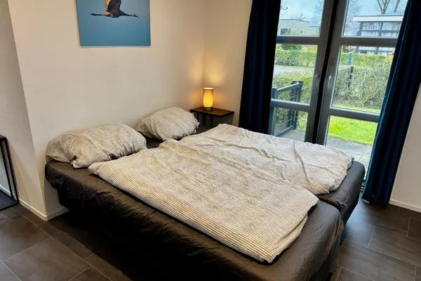  EuroParcs Marina Strandbad Chalet IJssel Lodge mit Zaun Haus Nr. 34