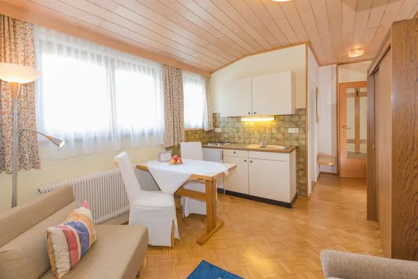 Kitchen with dining area  City Life 5 by Alpenidyll Apartments