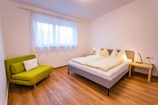 Schlafzimmer 1, Doppelbett  City Dream 1 by Alpenidyll Apartments