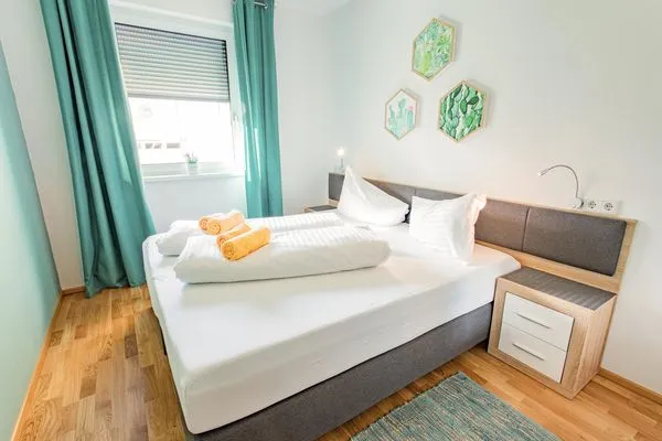 Bedroom with a double bed  Sunny Aich by Alpenidyll Apartments