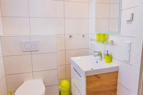 Bathroom with toilet and shower  Sunny Aich by Alpenidyll Apartments