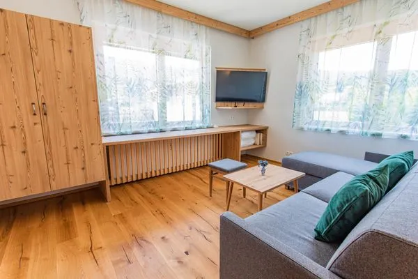 Schlafsofa  und Fernseher  Bergidyll 4 by Alpenidyll Apartments