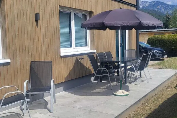 Outdoor area with seating  Lasserhäusl by Alpenidyll Apartments