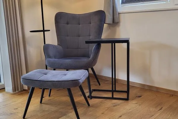 A reading chair with a view of the mountains  Fischbacher App. 1 by Alpenidyll Apartments