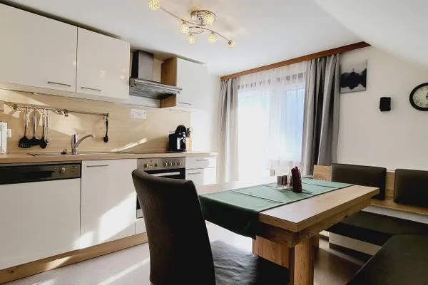 Kitchen island and dining area  Fischbacher App. 3 by Alpenidyll Apartments