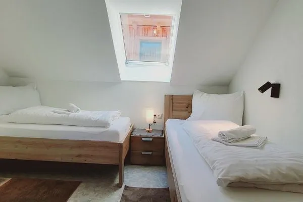 Bedroom 2, 2 single beds  Fischbacher App. 3 by Alpenidyll Apartments