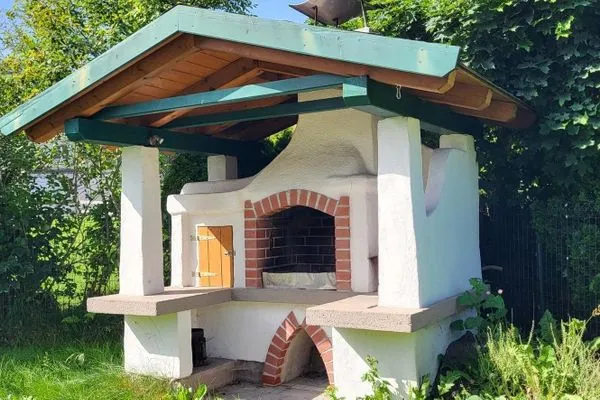 Außenbereich mit großem Griller  Ferienhaus Aich by Alpenidyll Apartments