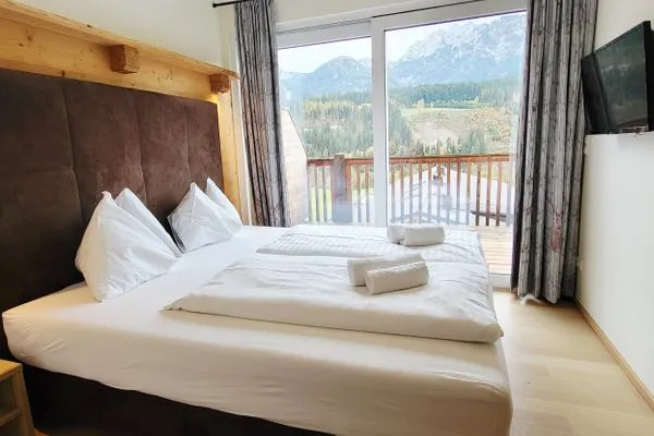 Bedroom 1, double bed and TV  Mountain View by Alpenidyll Apartments