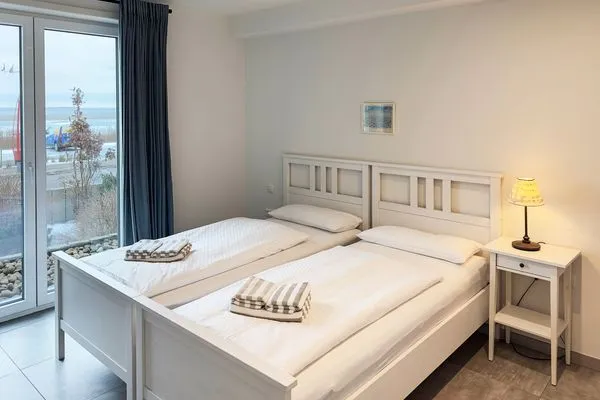 Schlafzimmer Haus *Weiße Düne* Ferienwohnung Weiße Düne 4