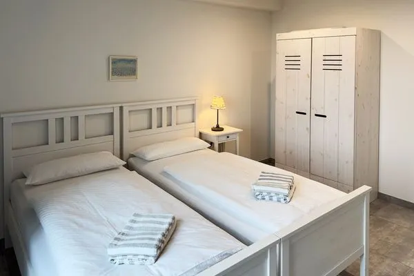 Schlafzimmer Haus *Weiße Düne* Ferienwohnung Weiße Düne 4