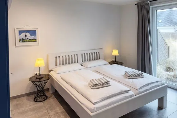 Schlafzimmer Haus *Weiße Düne* Ferienwohnung Weiße Düne 4