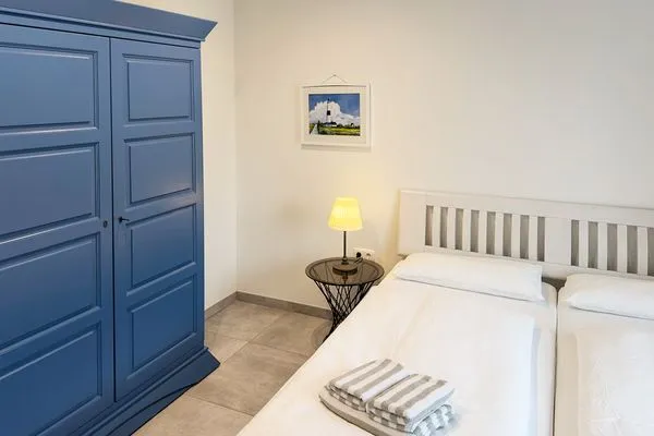 Schlafzimmer Haus *Weiße Düne* Ferienwohnung Weiße Düne 4