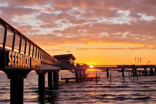 Sonnenaufgang am Strand von Haffkrug-Scharbeutz  Strandnahe Mini Ferienwohnung im Souterrain mit gratis Wäschepaket