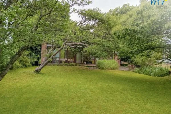 Außenansicht vom Garten aus auf das Haus Haus Kiebitzdelle-Leegde 16 Ferienhaus Müller