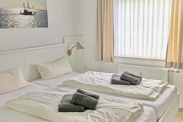 Schlafzimmer Uns Huus Ferienwohnung 8