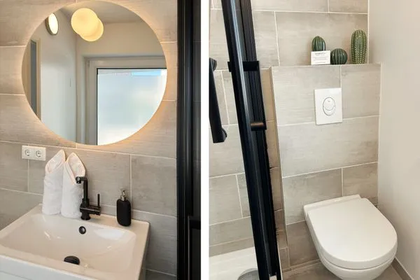 Sauberes und modernes Badezimmer mit Fenster  Romantische Ferienwohnung am Hafen mit gratis Bettwäsche-Paket und Terrasse