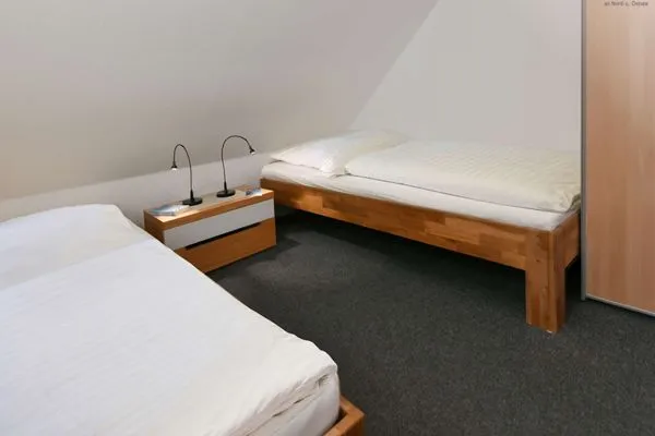 Schlafzimmer Kleine Pinkenburg Ferienwohnung Nord und Süd
