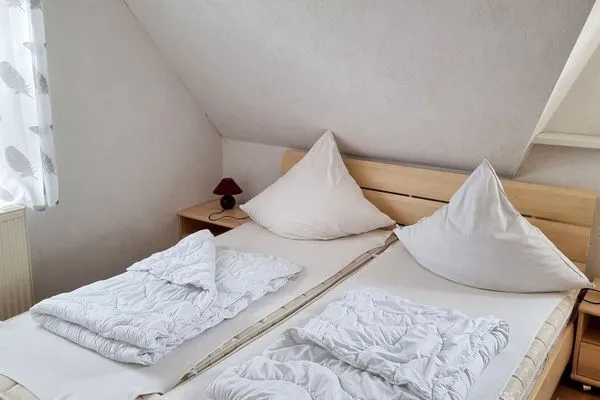 Schlafzimmer  Ferienwohnung Johanna - am Wieker Bodden gelegen
