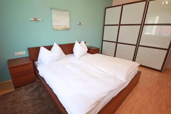 Schlafzimmer mit Doppelbett  Apart  15 by Alpenidyll Apartments