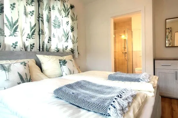 Bedroom 1 with shower and toilet  Lasserhäusl by Alpenidyll Apartments