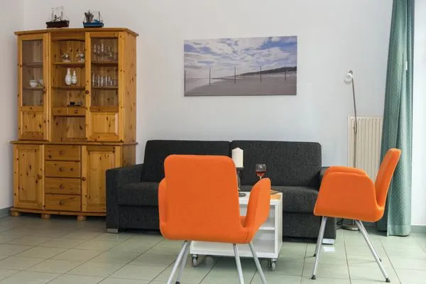 Wohnzimmer mit Schlafcouch Landhaus Heine Eck-Huus Whg. 01