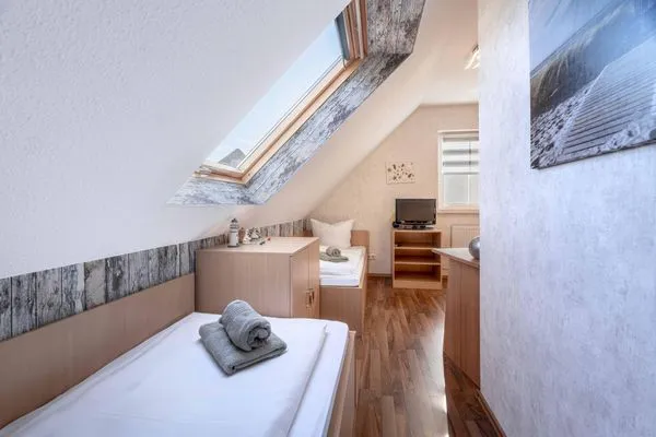 Schlafzimmer mit Einzelbetten  Am Deich Haus 8