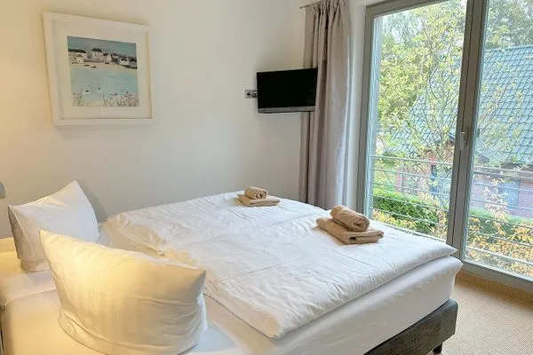 1. Schlafzimmer mit Doppelbett  Achternhus Fiete