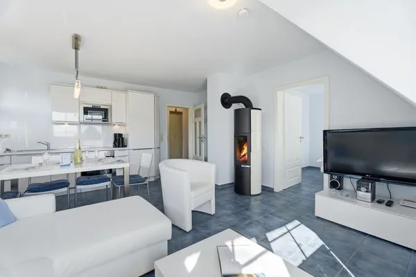 Wohnbereich mit Kamin  de Obendtied - Wohnung 4